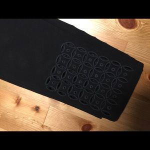 Super cute black pants with design on bottom!